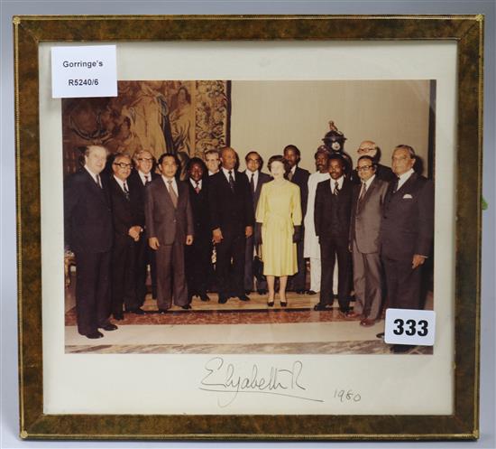 Royal Interest: A coloured photograph of The Queen and Commonwealth Heads of State, signed by The Queen,
